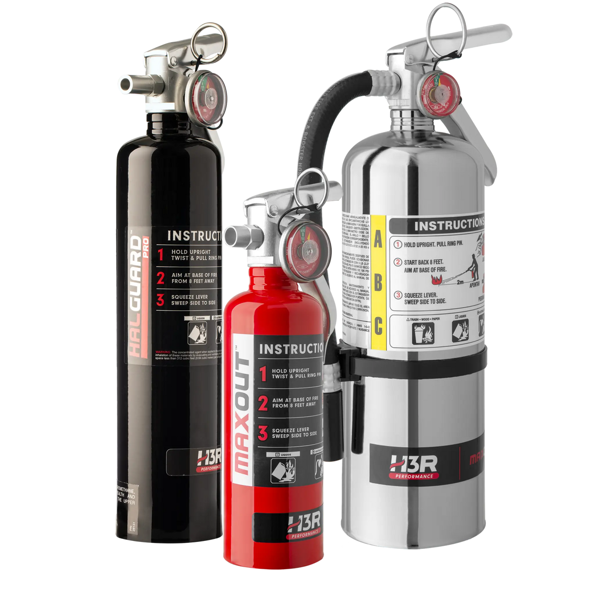 Three fire extinguishers on a plain white studio background: a tall black Halguard Pro extinguisher, a red MaxOut portable extinguisher, and a chrome H3R ABC extinguisher with a black hose connecting them.